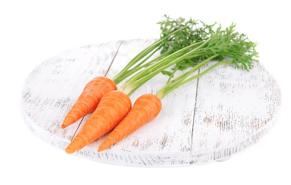 Fresh carrot on wooden stand — Stock Photo, Image