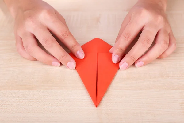 Hands making origami figure, close up — Stock Photo, Image