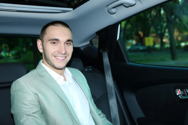 Man sitting in car — Stock Photo, Image