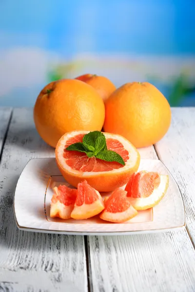 Ripe grapefruits on plate — Stock Photo, Image