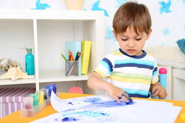 Cute little boy painting in room — Stock Photo, Image
