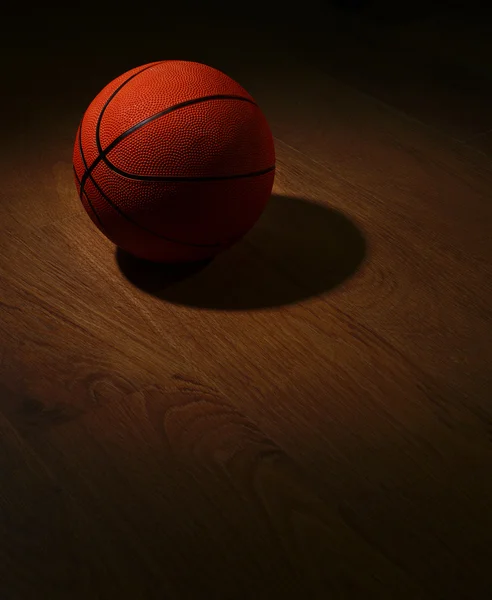 Basketball ball on floor — Stock Photo, Image