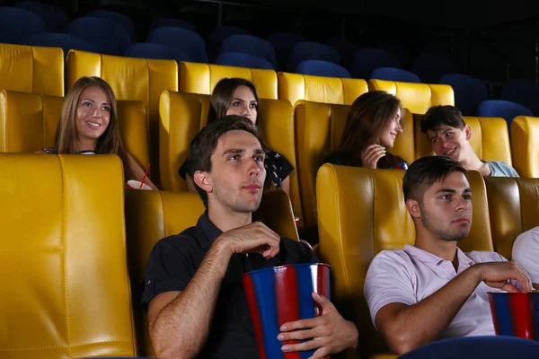 Young people watching movie in cinema — Stock Photo, Image