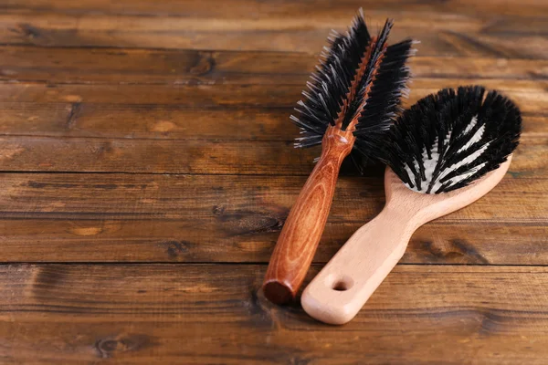 Wooden hairbrushes on wooden background — Stock Photo, Image