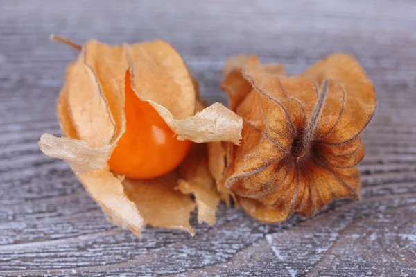 Physalis fruits on wooden background — Stock Photo, Image