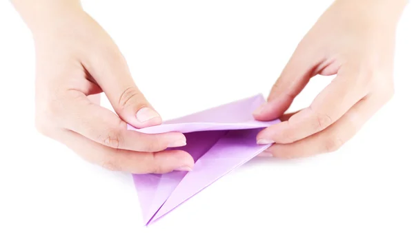 Manos haciendo origami juguete, de cerca, aislado en blanco —  Fotos de Stock