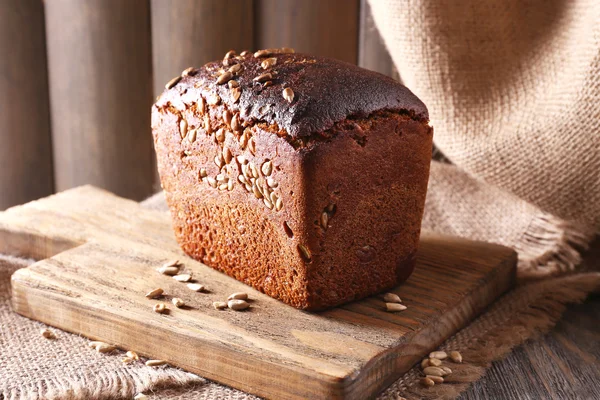 Fresh bread on wooden table, close up — Stock Photo, Image