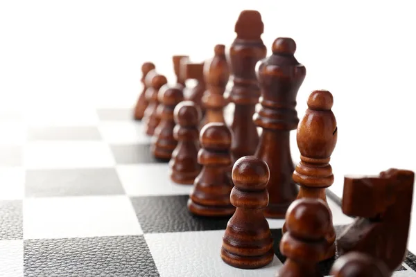 Chess board with chess pieces isolated on white — Stock Photo, Image