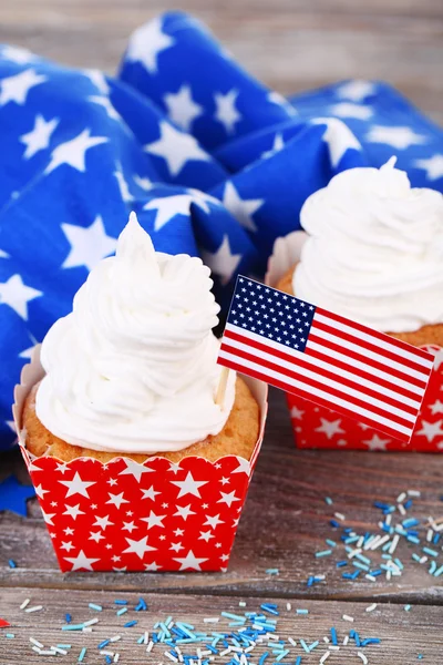 American patriotic holiday cupcakes on wooden table Stock Photo