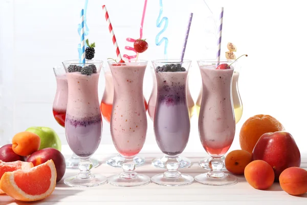 Delicious milkshakes on table, close-up — Stock Photo, Image