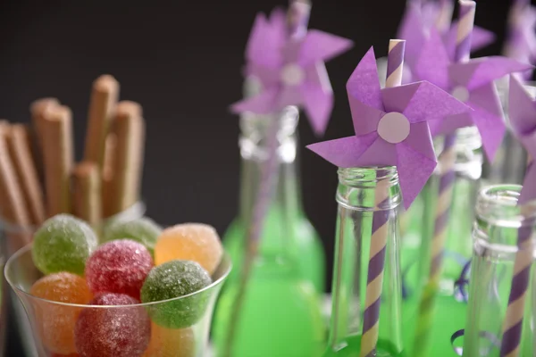 Bottles of drink with straw — Stock Photo, Image