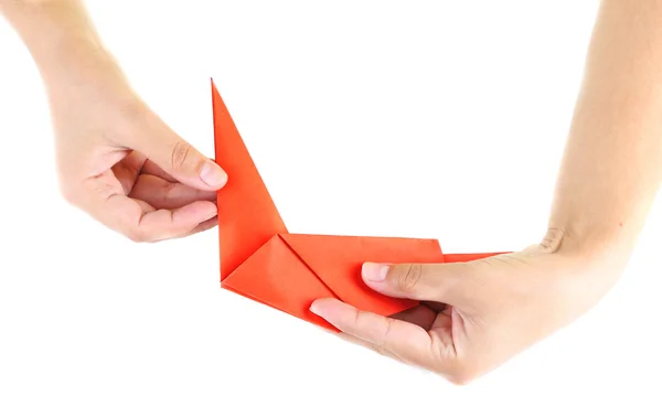 Hände machen Origami-Vogel, Nahaufnahme, isoliert auf weiß — Stockfoto