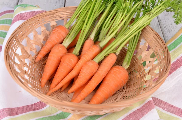 Fresh carrot in basket on table close up — Stock Photo, Image