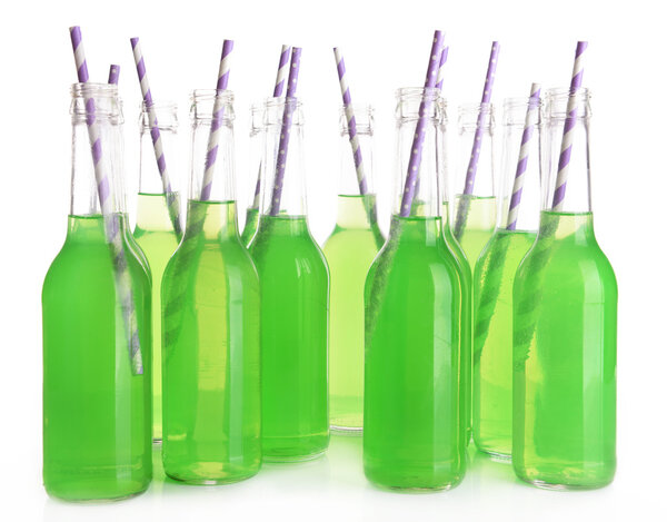 Bottles of drink with straw isolated on white