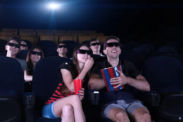 Young people watching movie in cinema — Stock Photo, Image