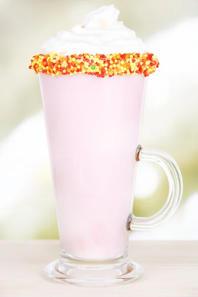 Delicious milk shake on table on light background — Stock Photo, Image