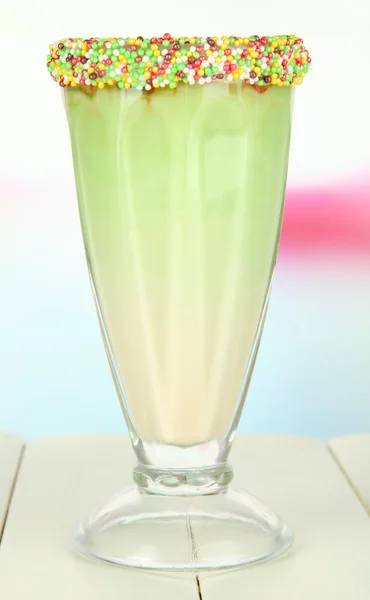 Delicious milk shake on table on light background — Stock Photo, Image