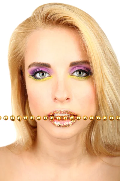 Beautiful woman with bright make-up and beads in teeth, close up — Stock Photo, Image