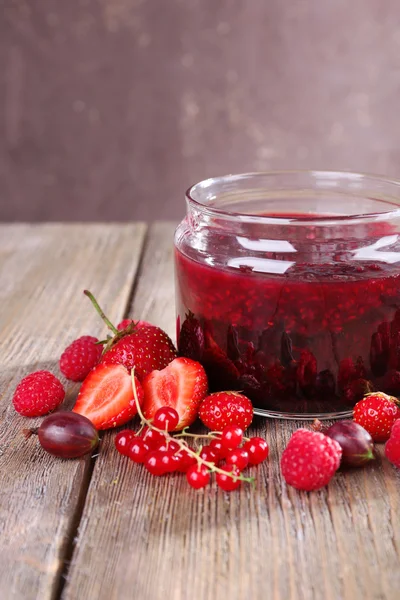 Berries jam in glass jar — Stock Photo, Image