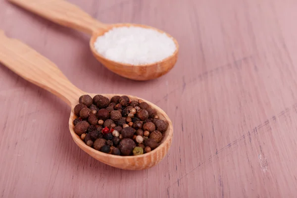 Salt and pepper in spoon — Stock Photo, Image