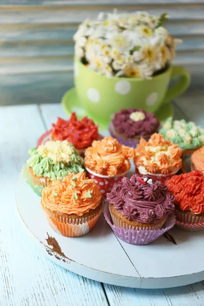 Tasty cupcakes on table — Stock Photo, Image