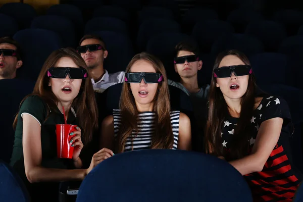 Young people watching movie in cinema — Stock Photo, Image