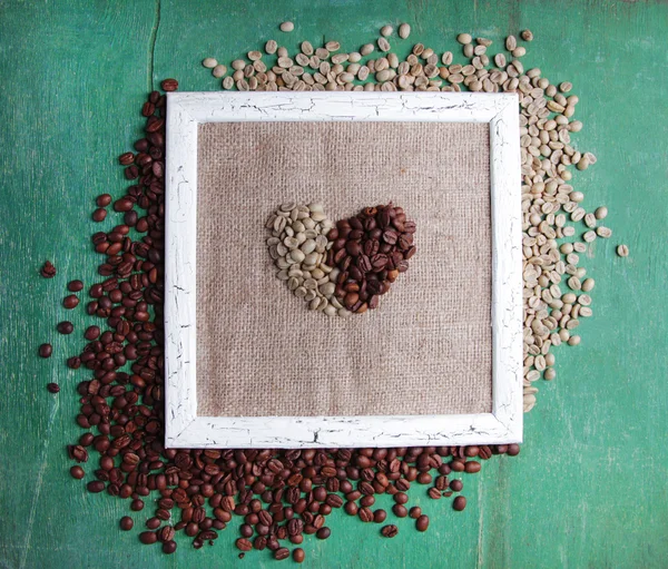 Cadre en bois et grains de café — Photo