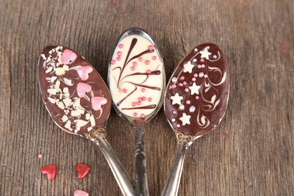 Spoons with tasty chocolate — Stock Photo, Image