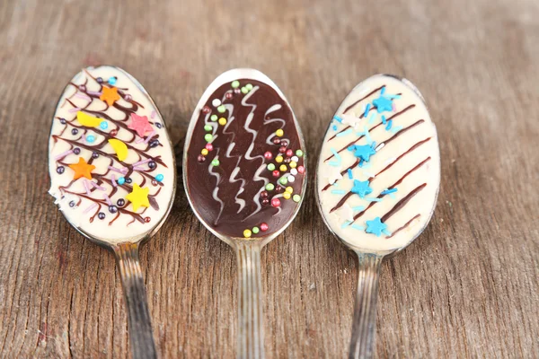 Spoons with tasty chocolate — Stock Photo, Image