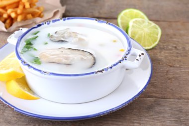 Tasty soup with oysters clipart