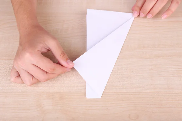 Hands making origami figure — Stock Photo, Image
