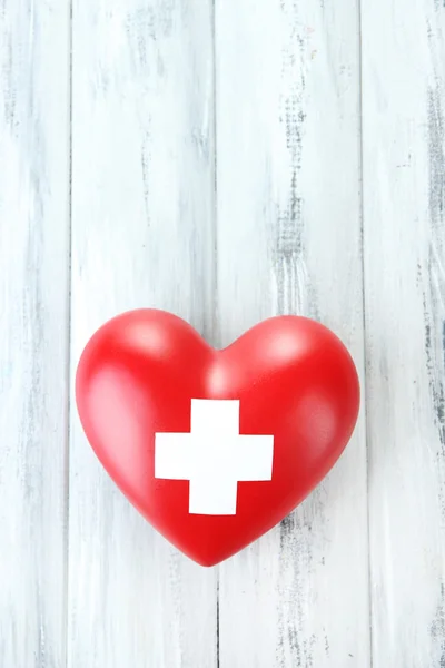 Red heart with cross sign — Stock Photo, Image