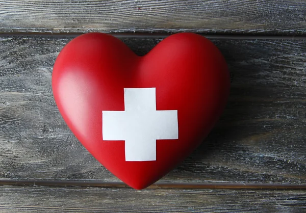 Red heart with cross sign — Stock Photo, Image