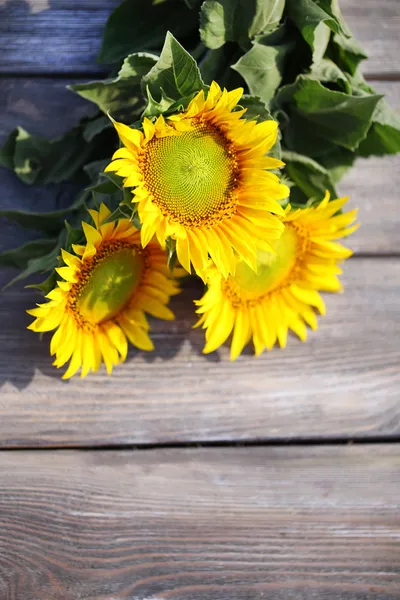 Beautiful sunflowers on table