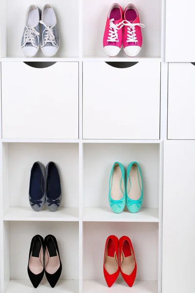 Colorful shoes on shelves — Stock Photo, Image