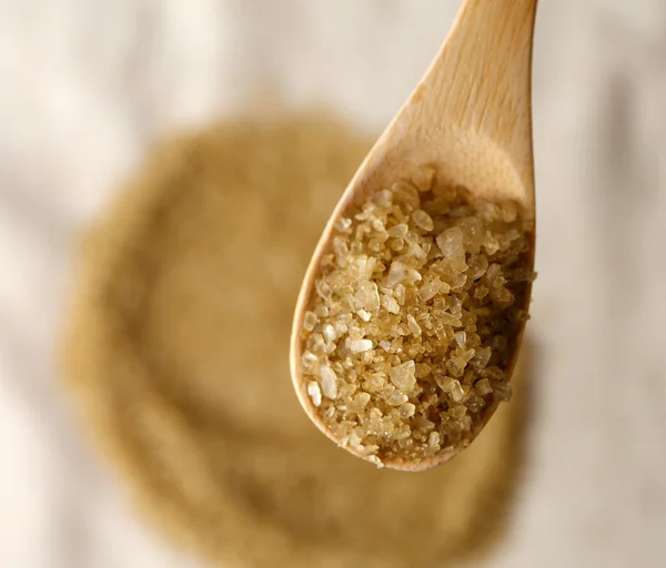 Sea salt in wooden spoon, close up — Stock Photo, Image
