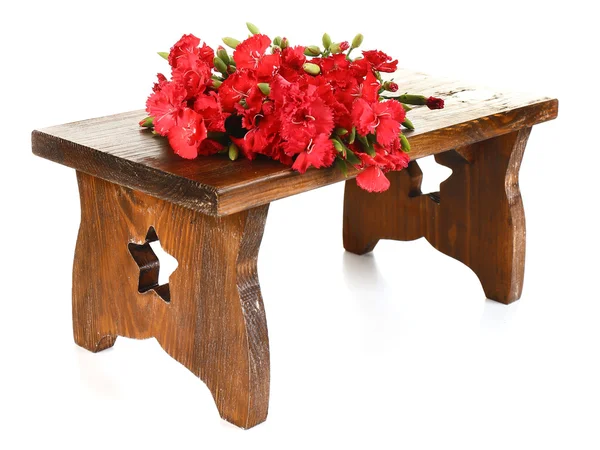 Flowers on wooden bench isolated on white — Stock Photo, Image