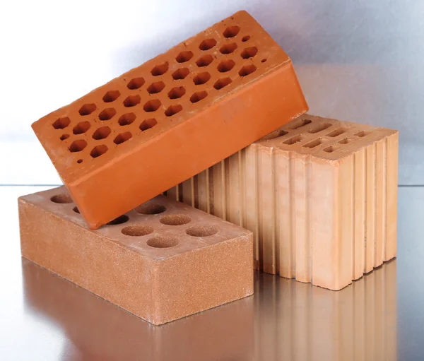 Bricks on metallic background — Stock Photo, Image