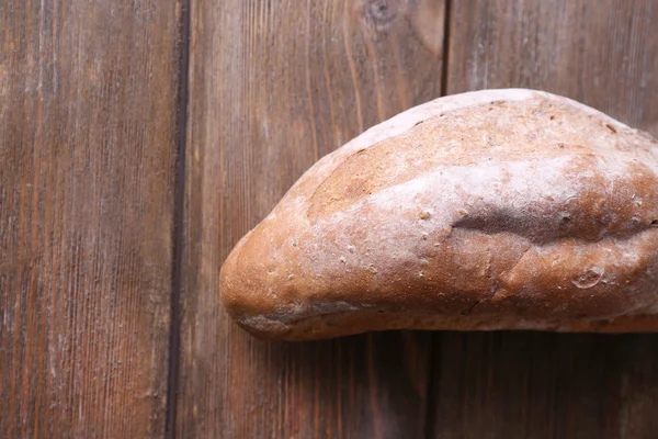 Chleb na drewniane tła — Zdjęcie stockowe