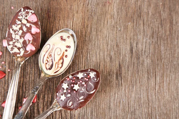 Spoons with tasty chocolate — Stock Photo, Image