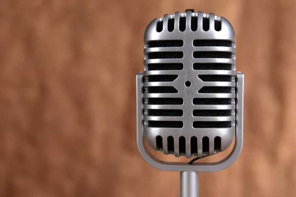 Vintage microphone on brown background — Stock Photo, Image