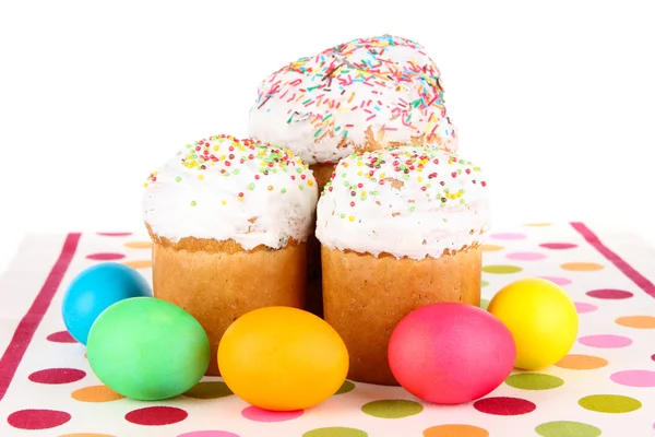 Sweet Easter cakes with colorful eggs isolated on white — Stock Photo, Image