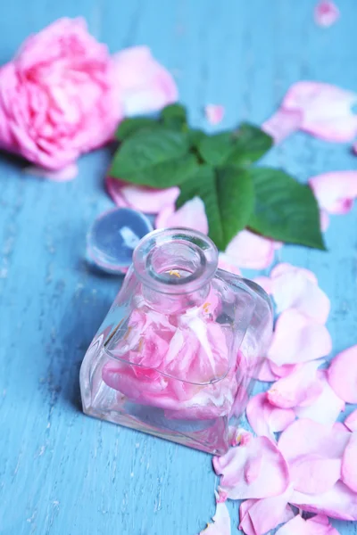 Rose oil in bottles — Stock Photo, Image