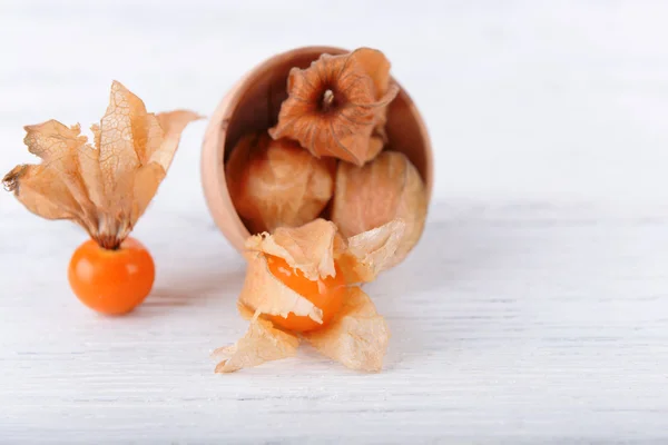Physalis fruits in wooden bowl — Stock Photo, Image