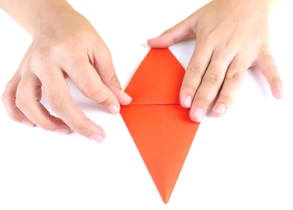 Hands making origami rabbit — Stock Photo, Image