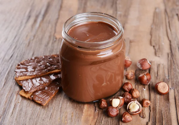 Sweet chocolate cream in jar — Stock Photo, Image