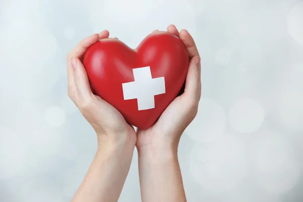 Red heart with cross sign — Stock Photo, Image