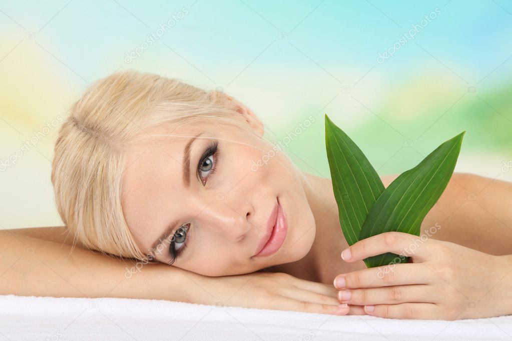 Woman with green leaves