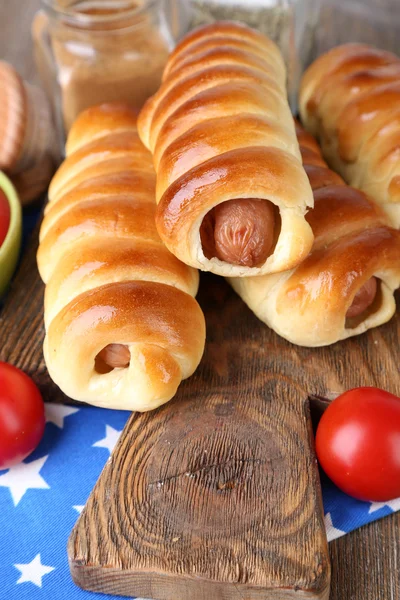 Baked sausage rolls on board — Stock Photo, Image