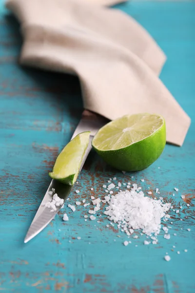 Fresh lime, knife and salt — Stock Photo, Image